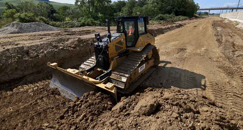 Caterpillar dozer levels the soil in a road construction project using Leica iCON gps 120 and Leica MC1 machine control system. 